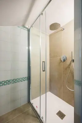 a shower with a glass door in a bathroom at More Holidays Sun in Mondello