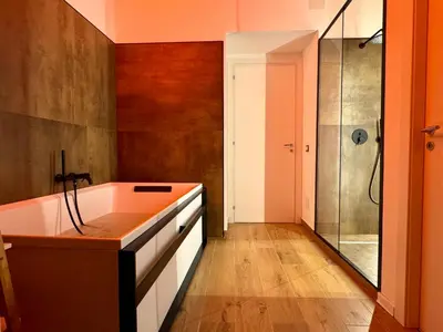 a bathroom with a tub and a shower at Paternostro Luxury Apartment in Palermo