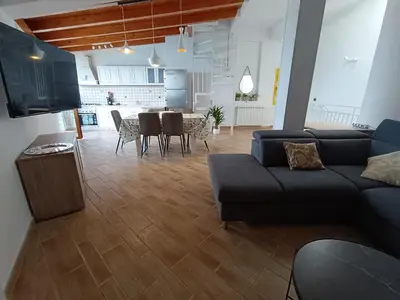a living room with a couch and a table at Finestra sul golfo in Balestrate
