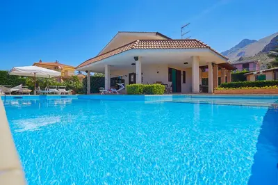 a large swimming pool in front of a house at Villa Cottone - 5 suite con piscina privata - tra Palermo e Cefalù in Altavilla Milicia