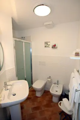 a bathroom with a sink and a toilet and a shower at B&B Teatro in Palermo