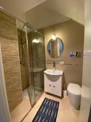 a bathroom with a shower and a toilet and a sink at Casa Vacanze Marco Polo vista mare in Trappeto