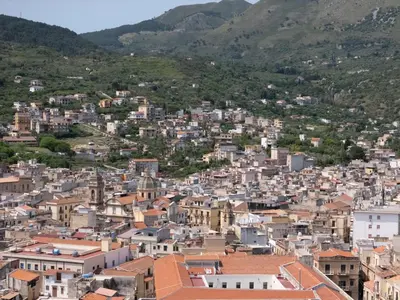 an aerial view of a city with mountains in the background at The Best View Sicily Apart in Carini