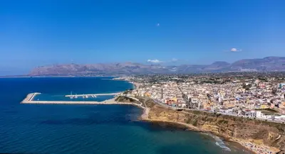 an aerial view of a city and the ocean at Baia Marina Suite with private jacuzzi in Balestrate
