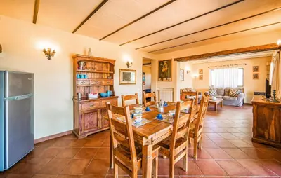 a kitchen and dining room with a table and chairs at Nice Apartment In Collesano Pa in Lascari