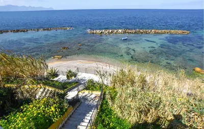 an island in the middle of the ocean at Beautiful Apartment In Trappeto in Trappeto