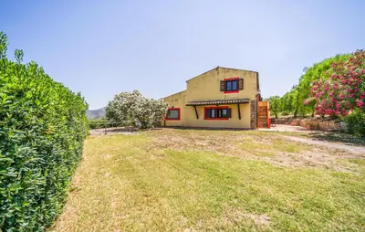 a house on a hill with a grass yard at Stunning Apartment In Collesano Pa in Lascari