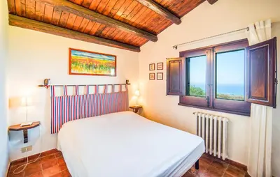 a bedroom with a bed and a window at Stunning Apartment In Collesano Pa in Lascari