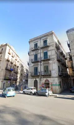 a living room with a bed and a couch at Palermo Centro Sampei in Palermo