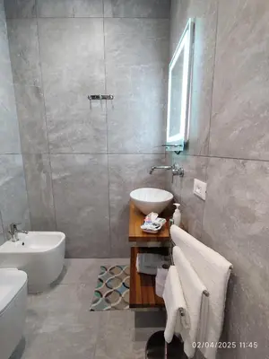 a bathroom with a white toilet and a sink at Palermo Centro Sampei in Palermo