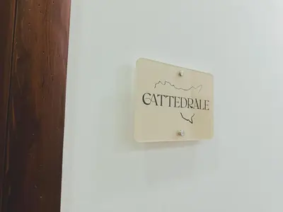 a white door with a sign that reads cartilage at Sicania - In centro Storico a Palermo in Palermo