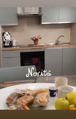 a kitchen counter with some food on a table at Palermo Centro Gaale in Palermo
