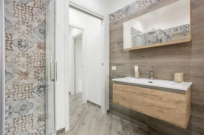 a bathroom with a sink and a shower at Erasmo home luxury, Palermo in Palermo