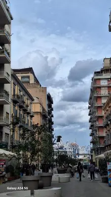 a city with buildings and people walking on a street at Nicasa, accogliente appartamento nel cuore di Palermo in Palermo