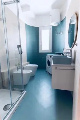 a bathroom with a toilet and a sink and a shower at DV holiday home in Isola delle Femmine