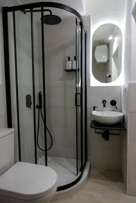 a bathroom with a shower and a toilet and a sink at Stratuzza Apartments in Palermo