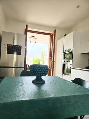 a kitchen with a table with a bowl on it at Villa Lumos Mondello Beach in Palermo