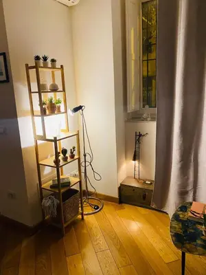 a room with a shelf with a lamp and a window at Cate Home historic center in Palermo