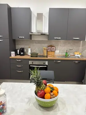 a bowl of fruit on a table in a kitchen at Residenza Stabile 64 in Palermo