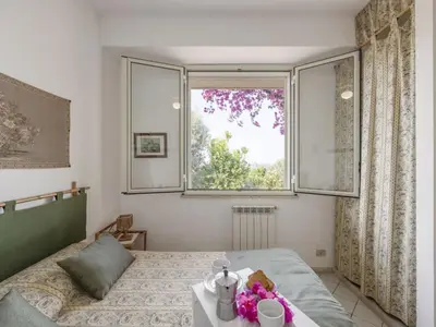 a bedroom with a bed and a window at Apartment Cicladi Leros by Interhome in Santa Flavia