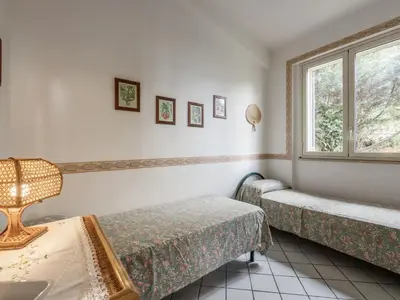 a room with two beds and a window at Apartment Cicladi Santorini by Interhome in Santa Flavia