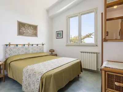 a bedroom with a bed and a window at Apartment Cicladi Kea by Interhome in Santa Flavia