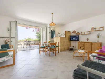 a living room with a couch and a table at Apartment Cicladi Mikonos by Interhome in Santa Flavia