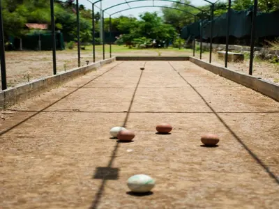 three balls are sitting on a tennis court at Apartment Cicladi Mikonos by Interhome in Santa Flavia