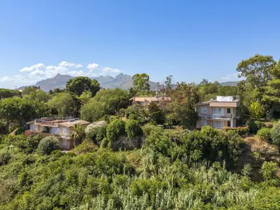 a group of houses on a hill with trees at Apartment Cicladi Mikonos by Interhome in Santa Flavia