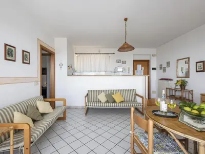 a living room with two couches and a table at Apartment Cicladi Paros by Interhome in Santa Flavia