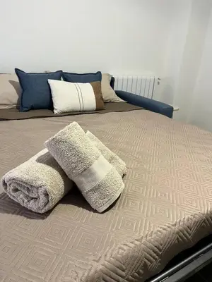 a bed with two pillows on top of it at Casa Francesca in Capaci