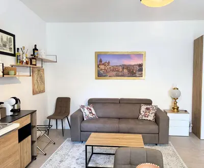 a living room with a couch and a table at Helena Apartments - Secondo Canto in Palermo