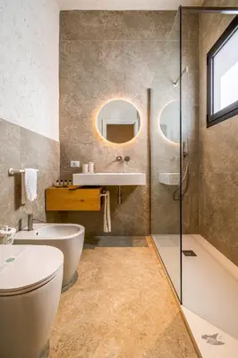 a bathroom with a sink toilet and a mirror at Villa Castello in Balestrate