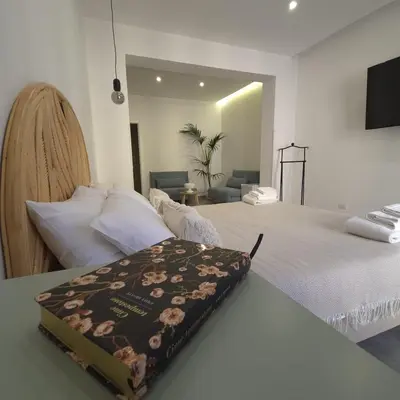 a bedroom with a bed with a blanket on it at La Ciconella 2 in Palermo