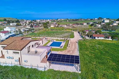 an overhead view of a house with solar panels on it at Villa Al-Kurum in Alcamo Marina