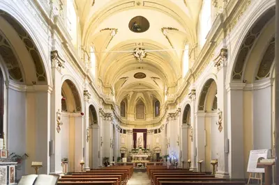 a large church with a row of pews in it at Capo Sweet Home in Palermo