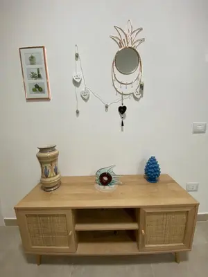 a wooden table with a mirror on top of it at DADE Houses in Bagheria