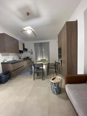 a living room with a kitchen and a dining room at DADE Houses in Bagheria