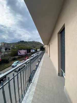 a balcony of a building with a view of a highway at DADE Houses in Bagheria