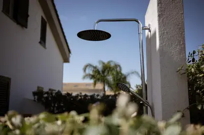 a light that is on the side of a building at Residence Salinelle Beach Villa Panarea in Lascari