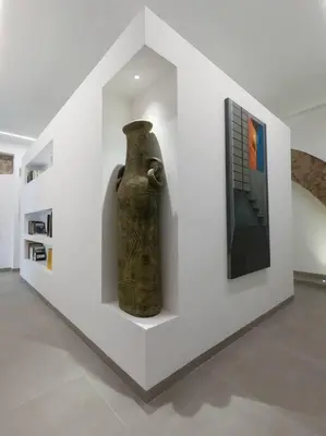 a vase sitting on a wall in a room at Genius Loci in Palermo
