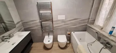 a bathroom with a toilet and a sink and a tub at Casa di Giulia in Palermo