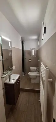 a bathroom with a toilet and a shower and a sink at Casa di Giulia in Palermo