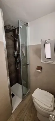 a bathroom with a shower and a toilet at Casa di Giulia in Palermo