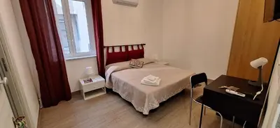 a small bedroom with a bed and a window at Casa di Giulia in Palermo
