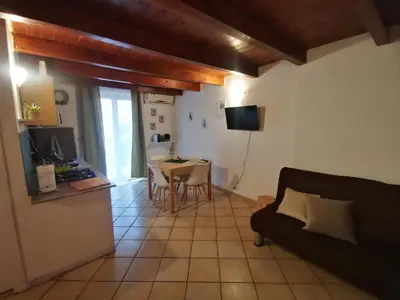 a living room with a couch and a table at kappa's house a granni in Palermo