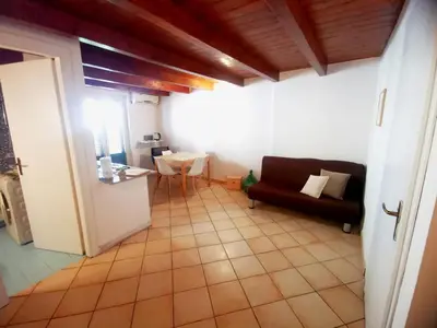 a living room with a couch and a table at kappa's house a granni in Palermo