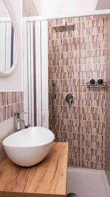 a bathroom with a white tub and a mirror at Leonetti in Carini