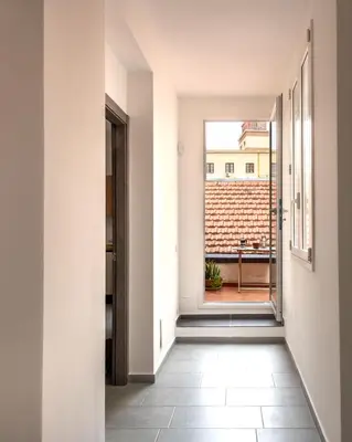 an empty hallway with a view of a balcony at Civico 61 in Palermo