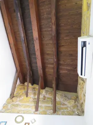 a corner of a room with a wooden ceiling at Loft with terrace in the city centre in Palermo